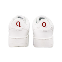 White Q sneakers, rear view with a red letter Q on the heel, white background